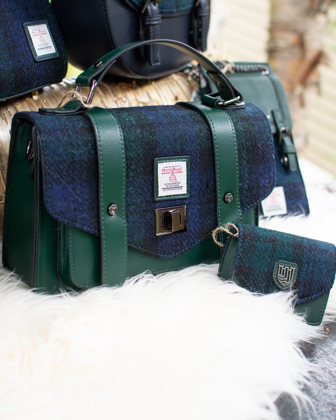 Green and blue patterned bags on a textured surface